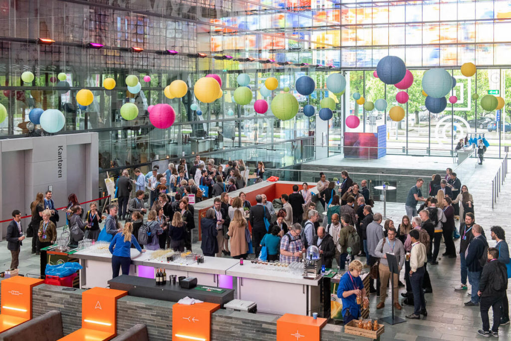 Photo of many people taking a coffee break at IIPC 2023