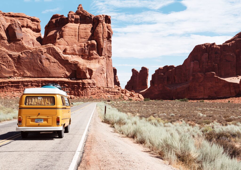 yellow Volkswagen bus on road